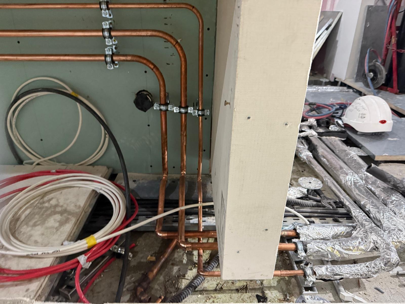 Copper pipework first fix through a partition wall