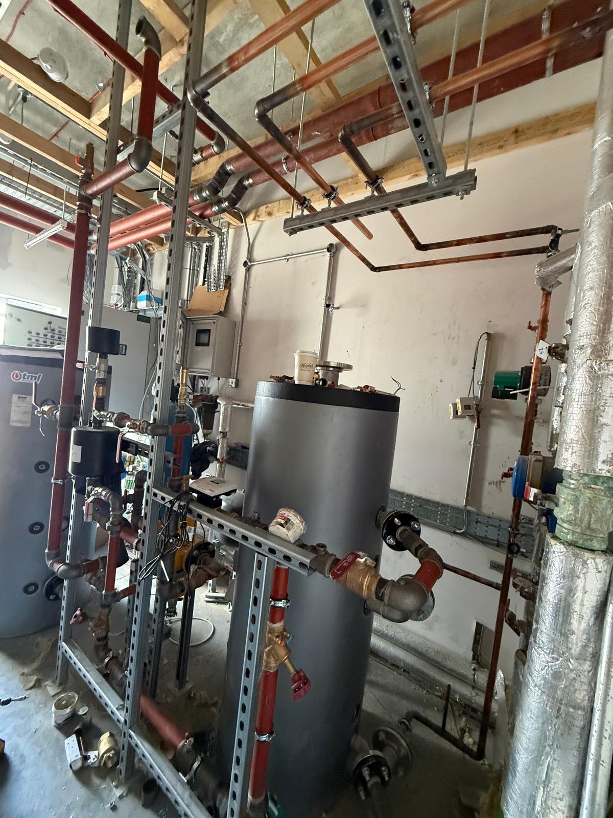 Unvented cylinders and pipework rack in a plant room