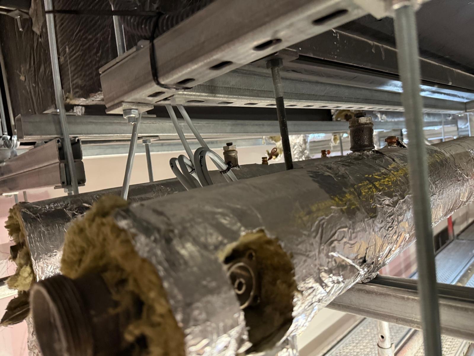 Insulated ductwork and services on a commercial roof